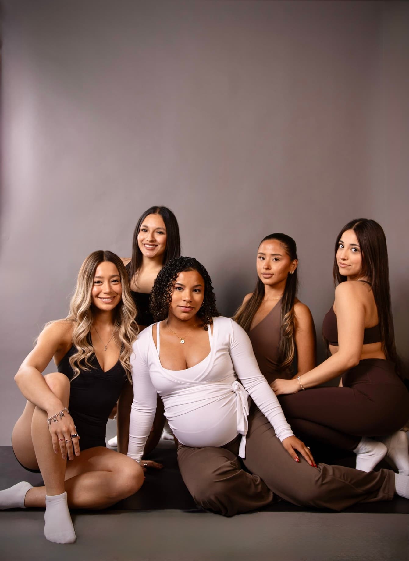 Five Form Society members together on the studio floor, facing the camera.